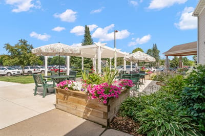 Outdoor seating area with flowers and umbrellas