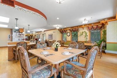 Dining area with tables and floral centerpieces