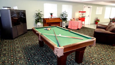 Common area with a pool table and seating