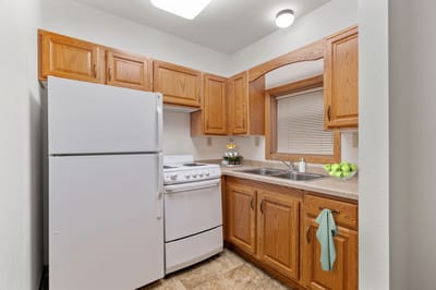 Bright, clean kitchenette with appliances and counter space