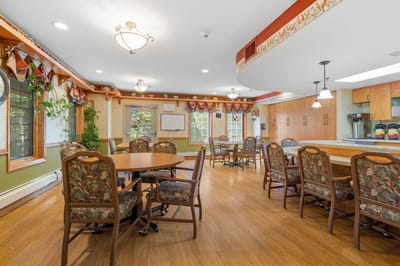 Dining area with tables and chairs in a facility