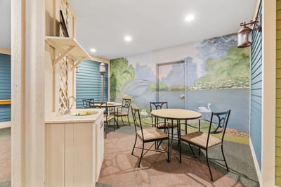 Colorful common area with tables and chairs