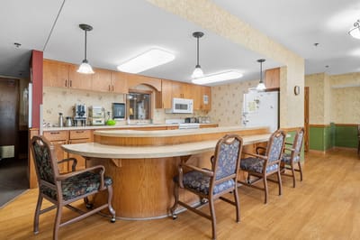 Common area with kitchen in senior care facility
