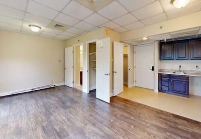 Interior view of a resident room with kitchenette