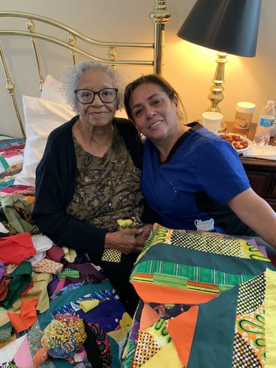 A resident and staff member engaged in an activity