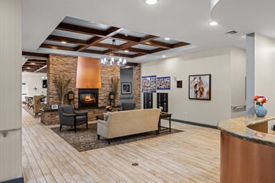 Cozy lounge area with fireplace in the facility