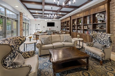 Common area with comfortable seating and bookshelves