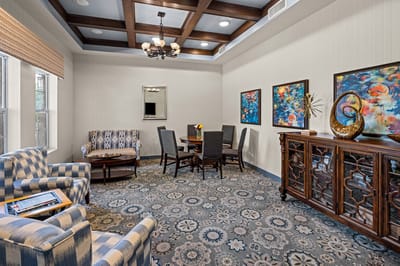 Bright common area with comfortable seating and artwork