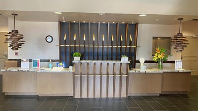 Reception area with modern decor and floral arrangements
