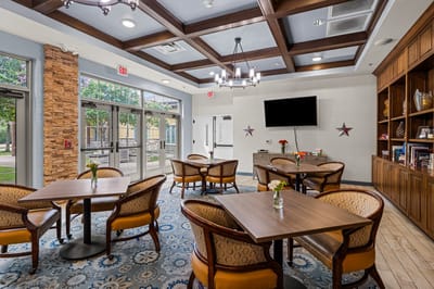 Bright common area with tables and chairs