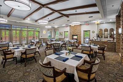 Bright dining room with tables set for meals