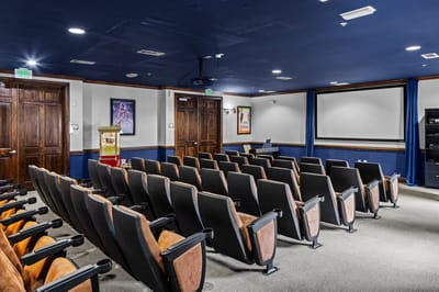 Interior view of a movie theater room with seating
