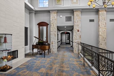 Interior view of a bright hallway with piano