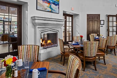 Cozy dining area with a fireplace and colorful decor