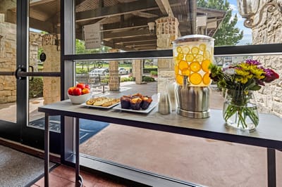Drink station with fruit-infused water and snacks