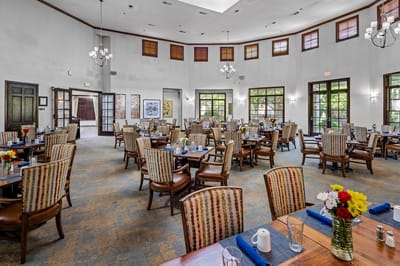 Dining room with tables set for residents