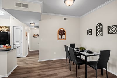 A bright dining area with a table and chairs