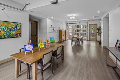 Activity room with residents' artwork displayed