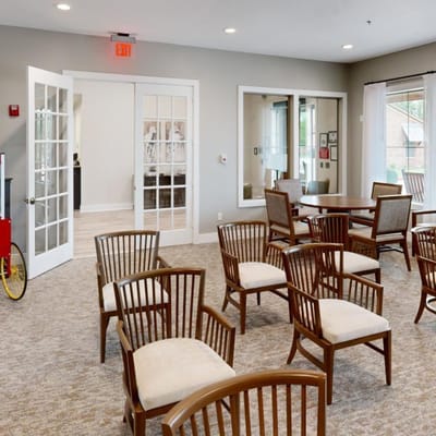 Interior common area with wooden chairs and soft lighting