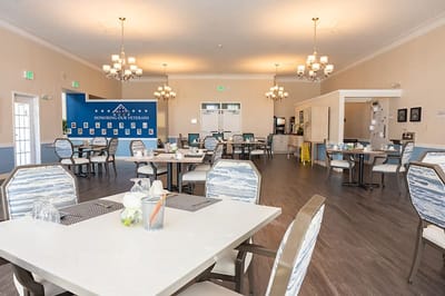 Dining room with tables and chairs for residents