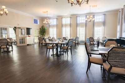 Dining area with tables and chairs in a well-lit room
