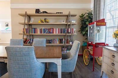 Bright common area with shelves and seating