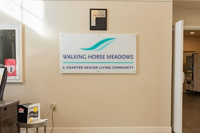 Facility logo on a wall inside the community