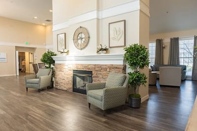 Interior common area with seating and a fireplace