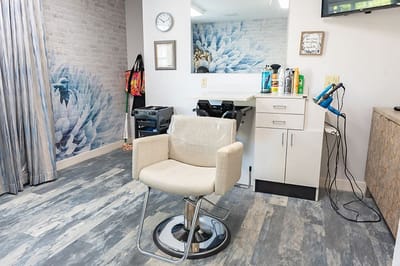 Bright salon area with modern decor and styling tools