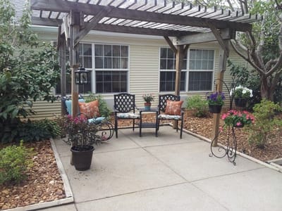 Outdoor seating area with plants and decor
