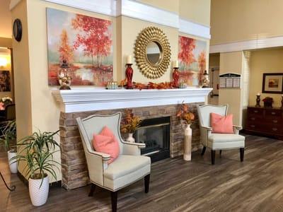 Cozy common area with decorative chairs and artwork