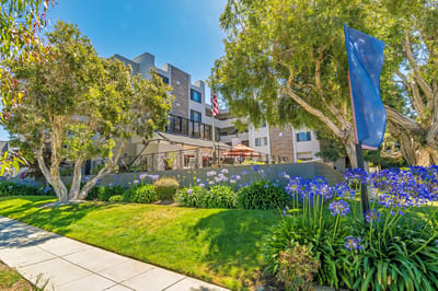Exterior view of Burlingame Senior Living with gardens