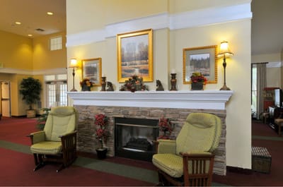 Cozy lobby area with seating and fireplace