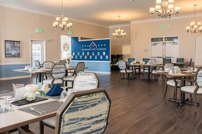 Dining room with tables set for residents