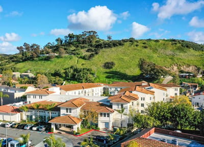 Aerial view of Bonita Villa Senior Living with green hills