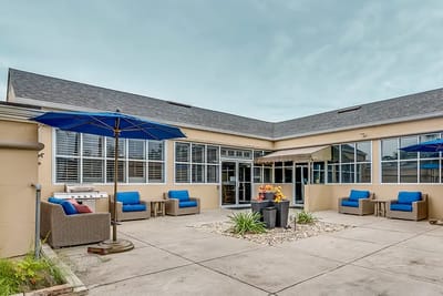 Outdoor seating area with umbrellas and lounge furniture