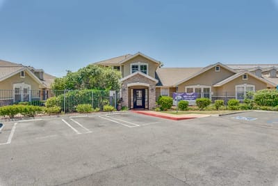 Exterior view of Newport Mesa Senior Living with landscaping