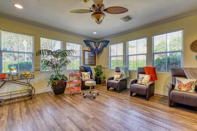 Bright common area with comfortable seating and plants