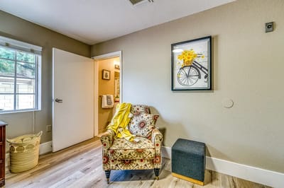 Cozy resident room with chair and decorative art