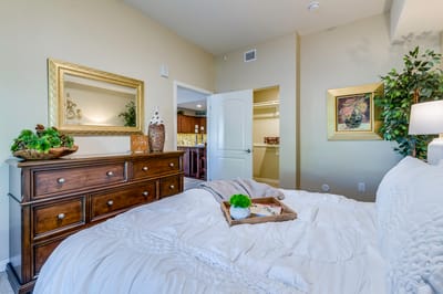 Cozy bedroom with decorative elements and a mirror