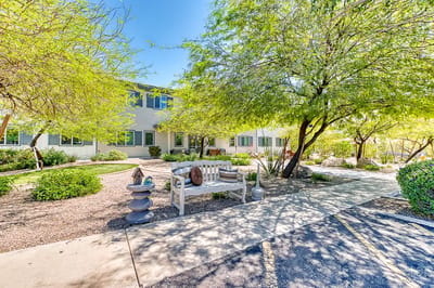Exterior view of Paradise Valley Senior Living with lush landscaping