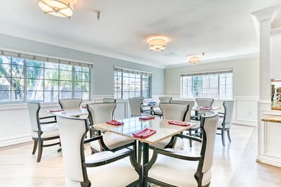 Bright dining room with tables set for meals