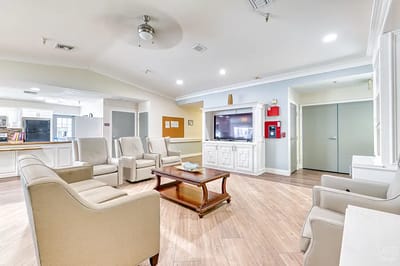 Bright common area with seating and a television