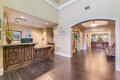 Interior view of a lobby area with a reception desk
