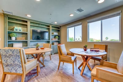 Bright common area with tables and chairs