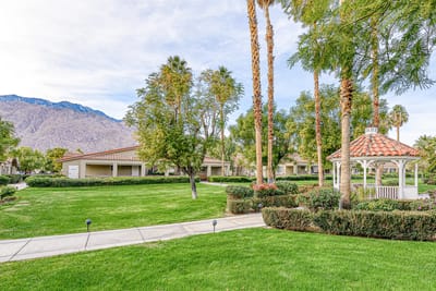 Well-maintained outdoor space with gazebos and palm trees