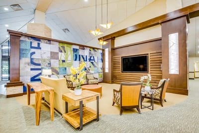 Interior lounge area with seating and decorative wall