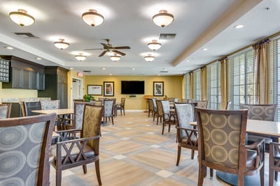 Bright dining area with seating and television