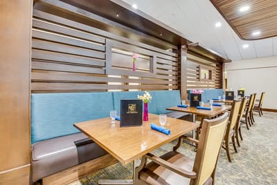 Dining area with tables and flower centerpieces