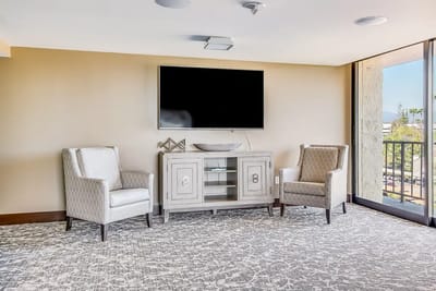 Bright interior seating area with a television